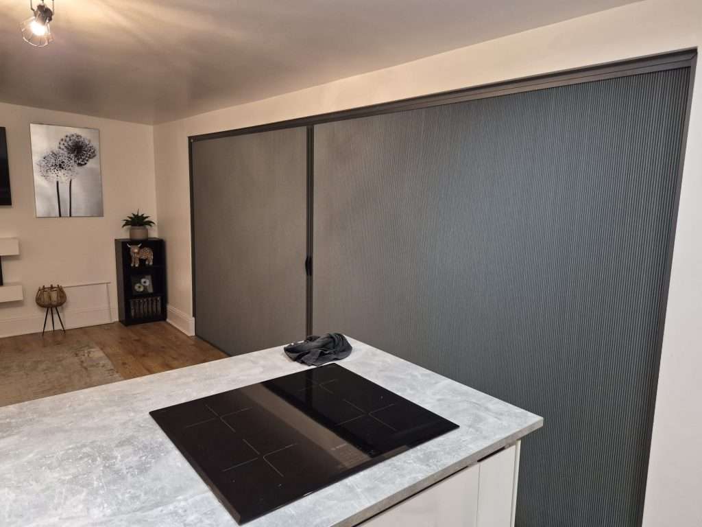 Dual-track BlindScreen installed on modern bifold doors