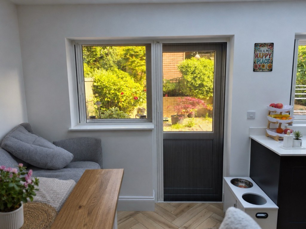 Bug screen mesh pulled across the kitchen door and side window in Stourbridge