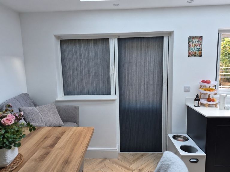Stourbridge kitchen diner with white BlindScreen frame and dark grey Scene Set fabric across the door and side window