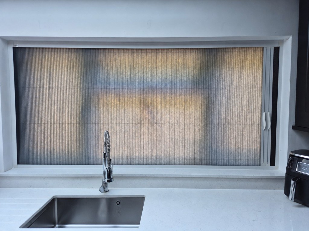 Kitchen sink window in Stourbridge with dark grey Scene Set fabric pulled across