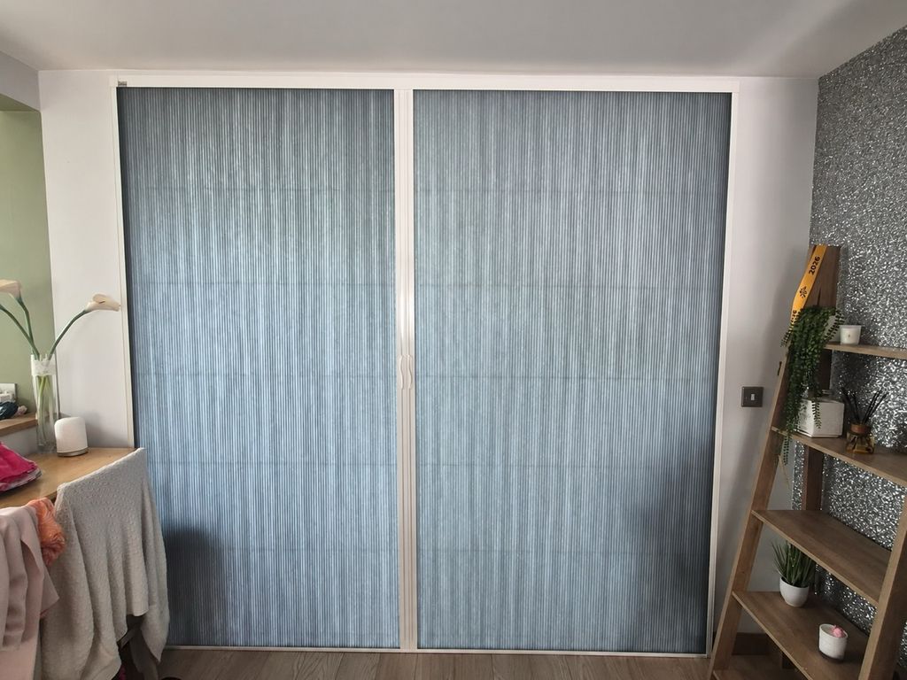 Wolverhampton living and dining rooms divided by a white BlindScreen frame with dark grey Scene Set fabric pulled across the opening