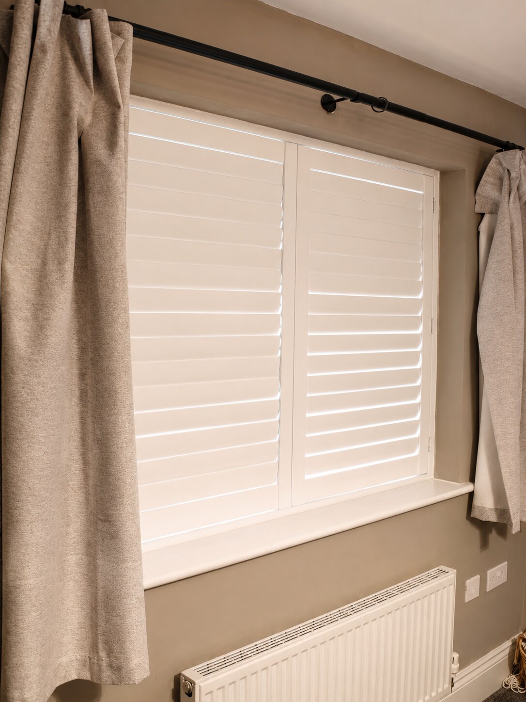 Albrighton bedroom composite shutters viewed at an angle with louvres tilted open