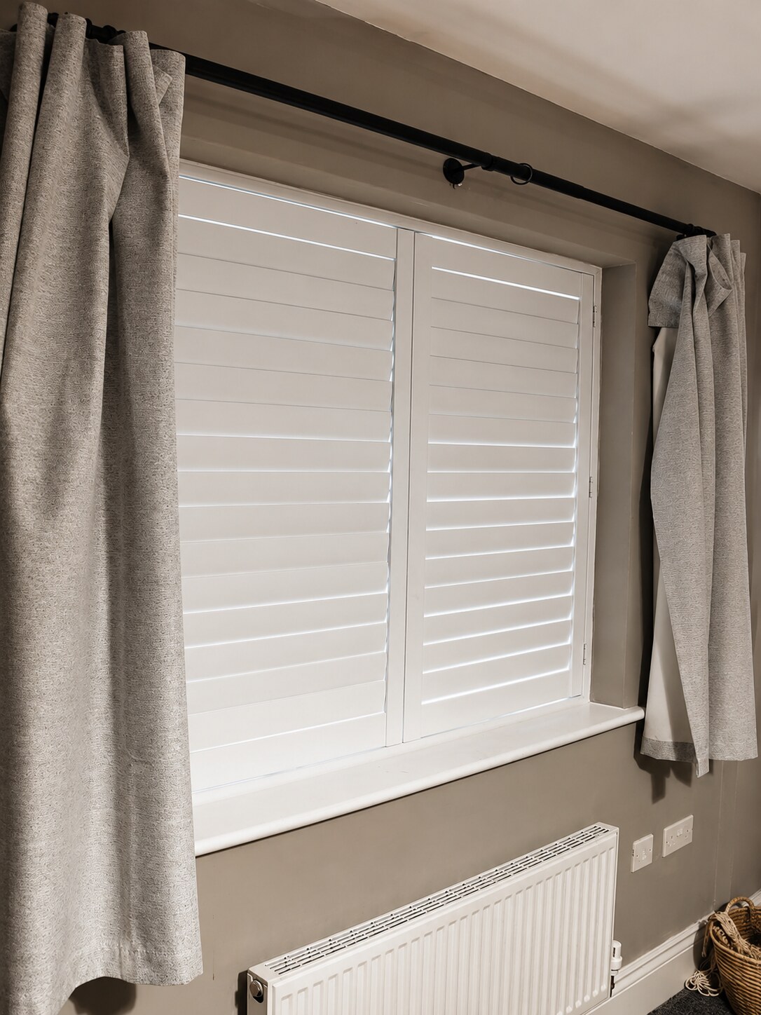Albrighton bedroom with Silk White composite shutters and all louvres fully closed