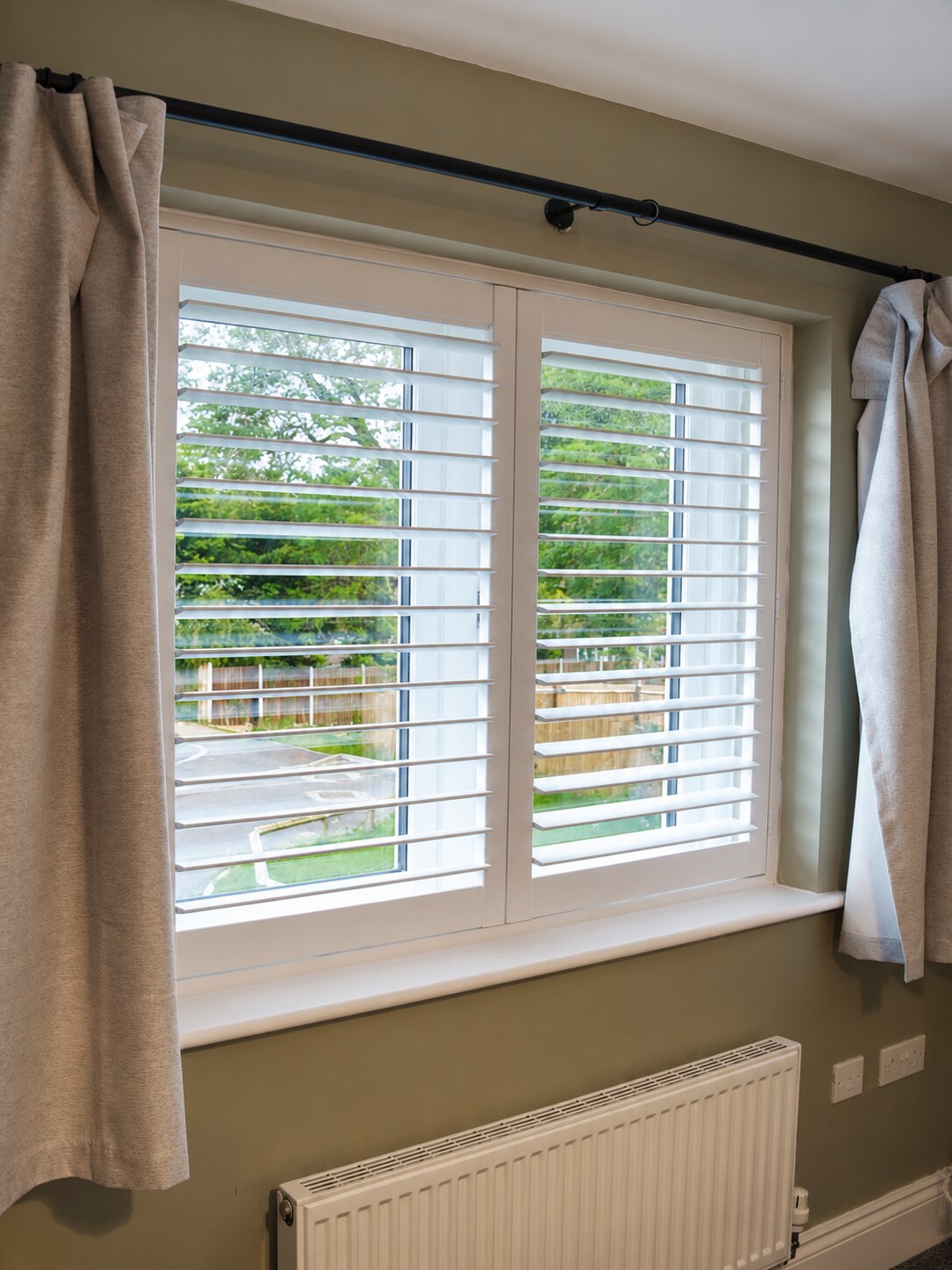 Albrighton bedroom composite shutters viewed straight on with louvres tilted open
