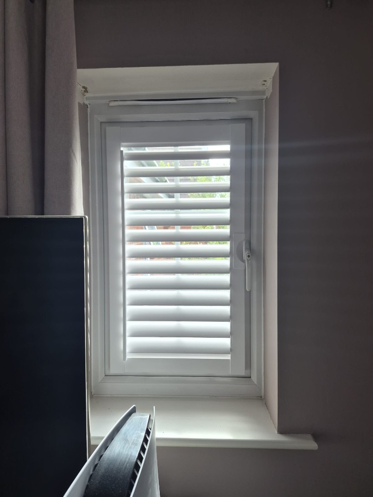 Baggeridge bedroom 2 small window with a Perfect Fit shutter clipped to the frame, louvres tilted open