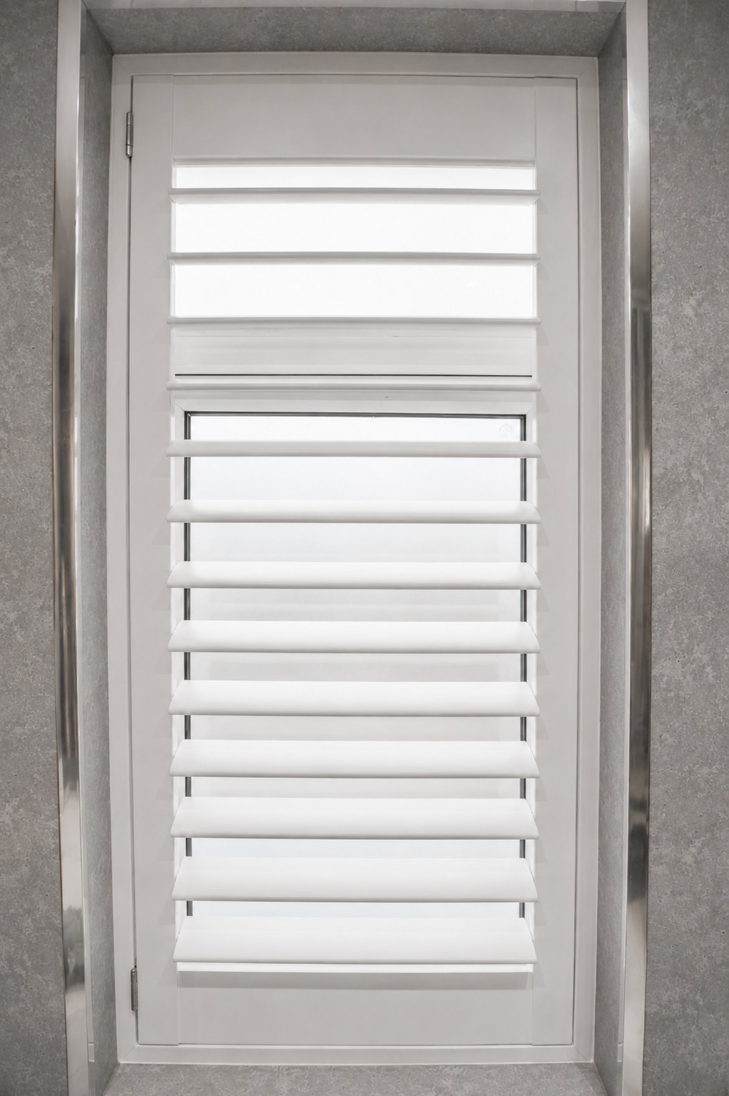 Brierley Hill bathroom with full height Pure White waterproof shutters fitted inside a white tiled window reveal