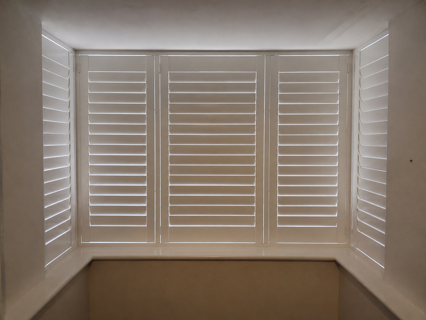 Halesowen box bay with five-panel Pure White shutters and all louvres fully closed