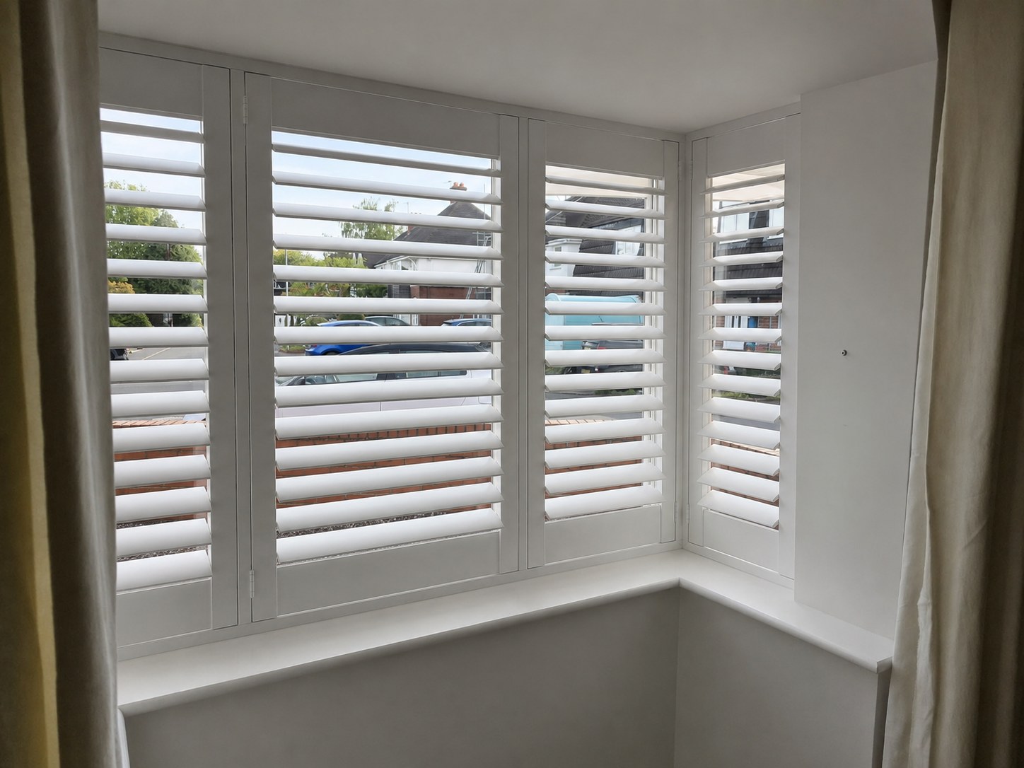 Halesowen dining room box bay shutters with louvres tilted open, viewed from the side