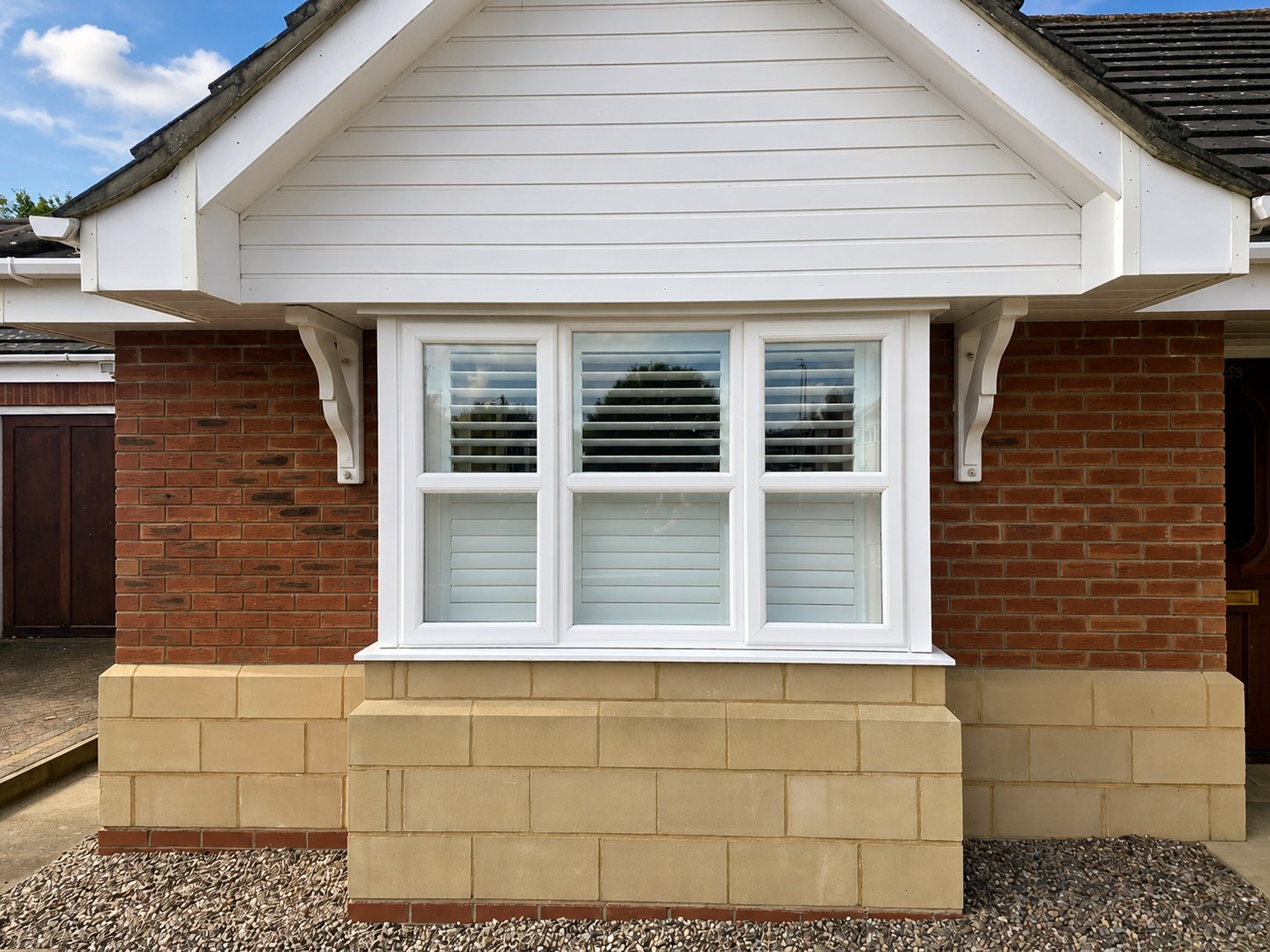Pure White box bay shutters on a Halesowen home viewed from the street