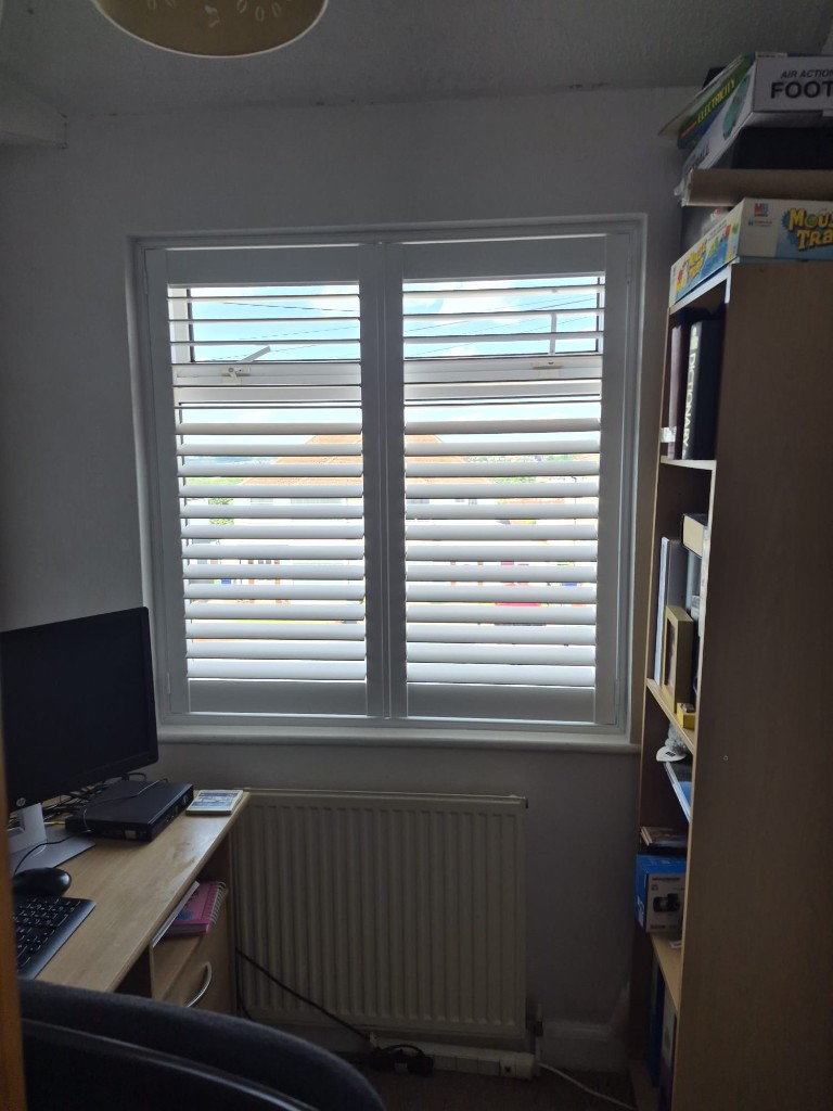 Halesowen home office shutters in Pure White with split tilt, lower louvres closed to reduce screen glare