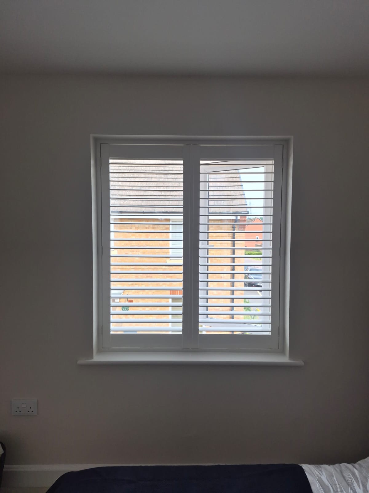 Kingswinford bedroom with full height composite shutters in Silk White, louvres closed