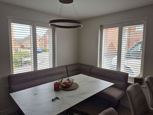 Kingswinford dining area with full height composite shutters in Silk White, split tilt with lower louvres closed and upper louvres open