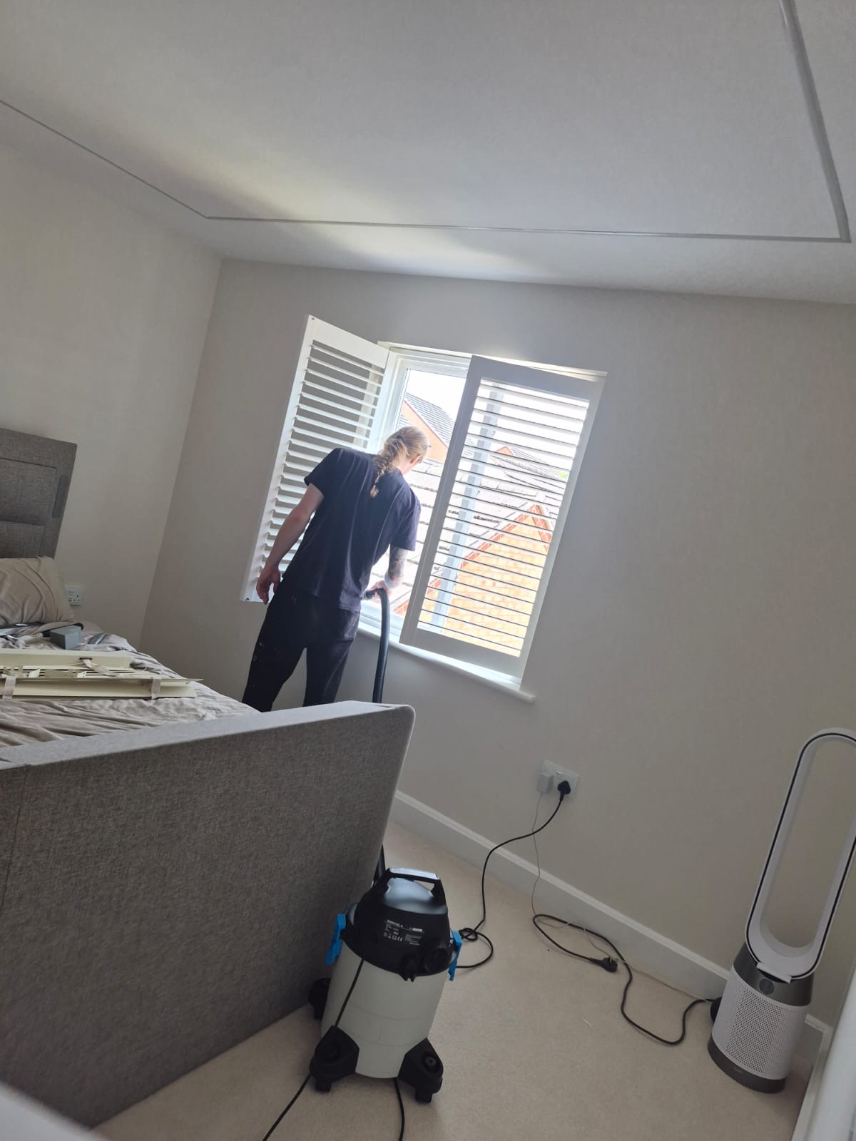Greystone Shutters fitting full height composite shutters in a Kingswinford bedroom, one panel open