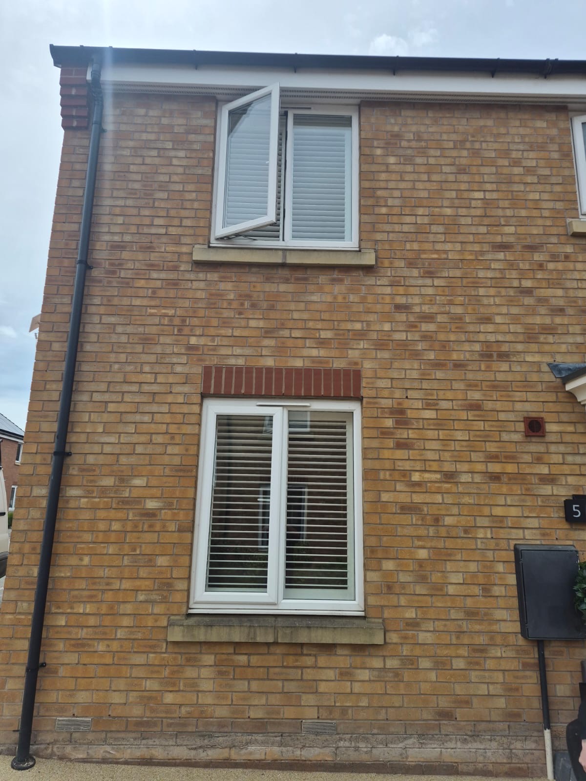 Kingswinford house exterior showing Silk White shutters on the upper floor with the casement window open