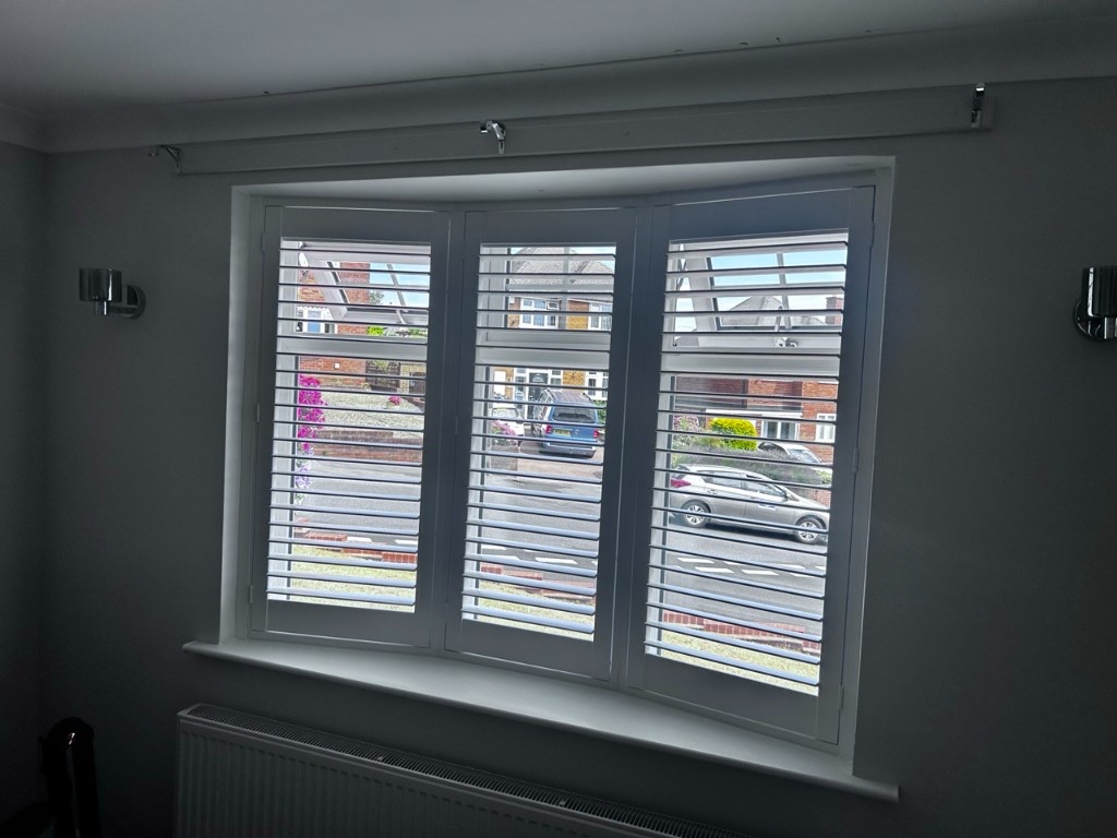 Dining room bay window with Pure White full height composite shutters, louvres open