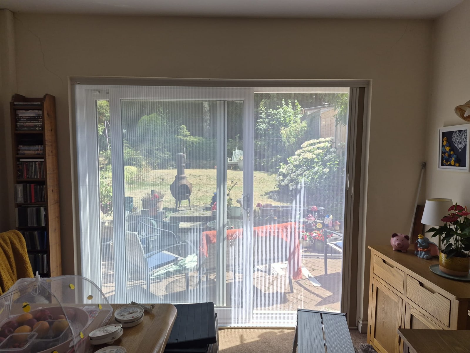 Dudley dining room sliding patio doors with Dual BlindScreen insect mesh drawn across