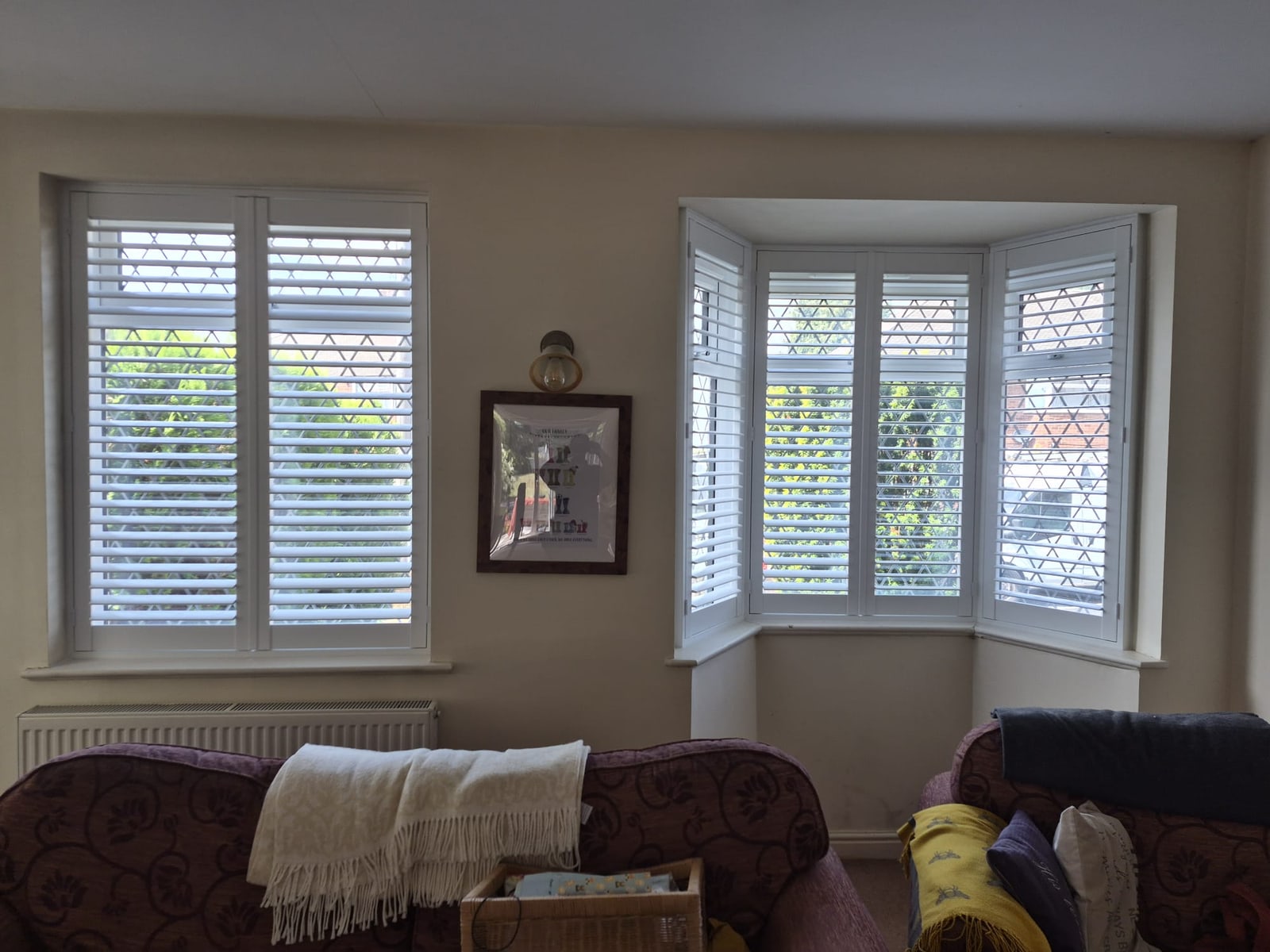 Dudley living room Pure White composite shutters with panels hinged fully open