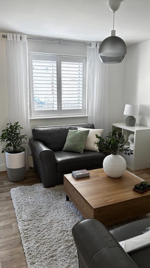 Full Height Pure White Shutters Installed in Living Room with 76mm Louvres - Open