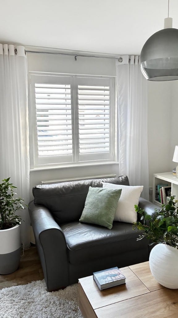 Full Height Pure White Shutters Installed in Living Room with 76mm Louvres - Open
