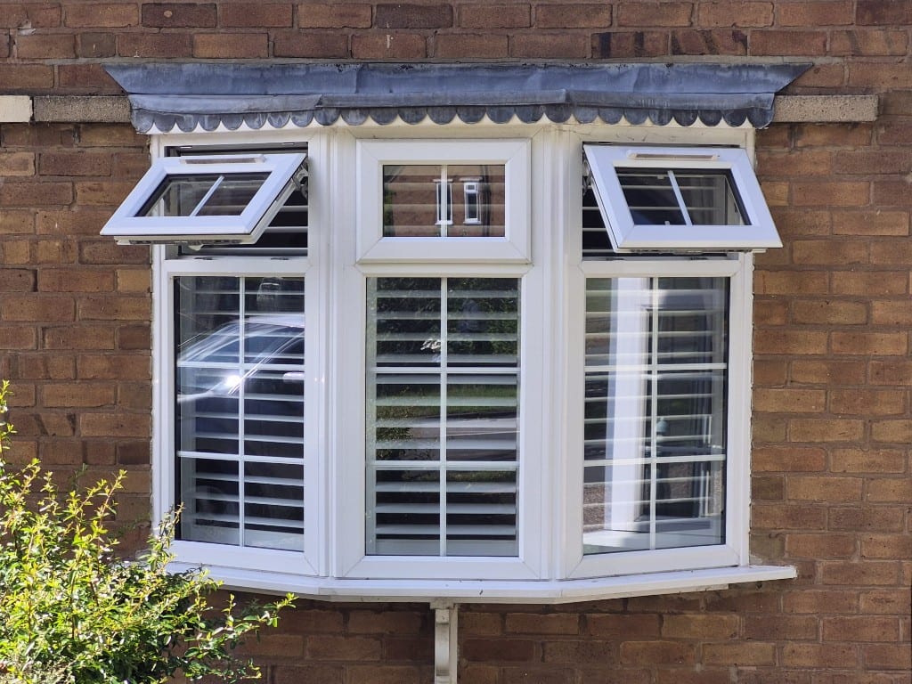 Full Height Pure White Shutters with 76mm Louvres - Outside Bay Window