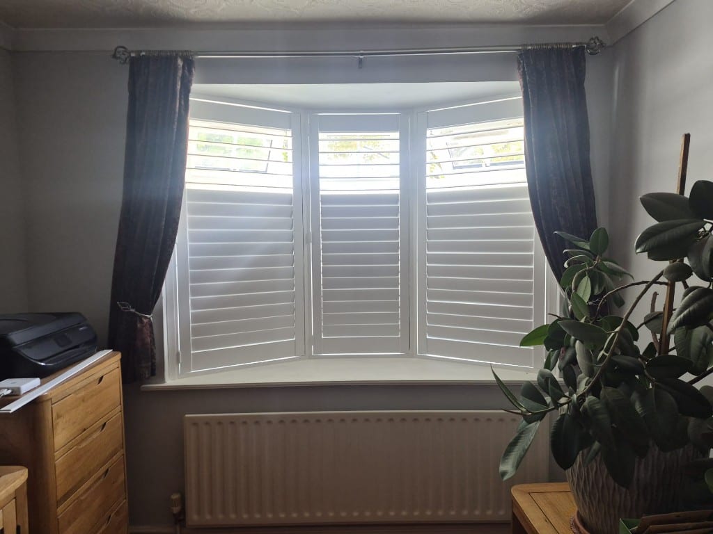 Full Height Pure White Engineered Wood Shutters with 76mm Louvres - Inside Bay Window Showcasing Split Tilt